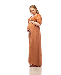 Image showing happy pregnant woman touching her big belly