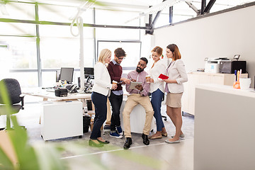 Image showing business team with tablet pc and coffee at office