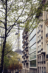 Image showing french paris street with Eiffel Tower in perspective trought trees, post card view