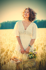 Image showing smiling beautiful woman in white summer dress in a field