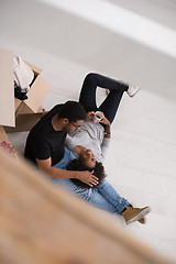 Image showing African American couple relaxing in new house