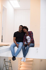 Image showing couple having break during moving to new house