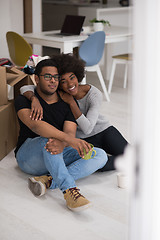 Image showing African American couple relaxing in new house