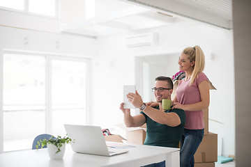 Image showing Young couple moving in a new home