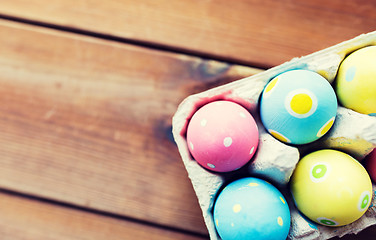 Image showing close up of colored easter eggs in egg box