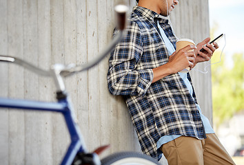 Image showing man with earphones and smartphone listening music