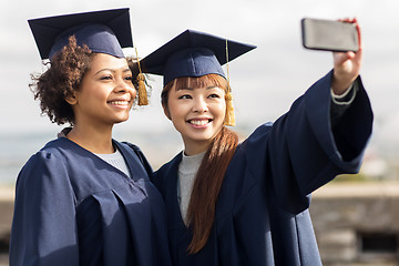 Image showing students or bachelors taking selfie by smartphone