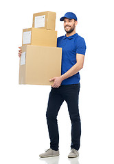 Image showing happy delivery man with parcel boxes