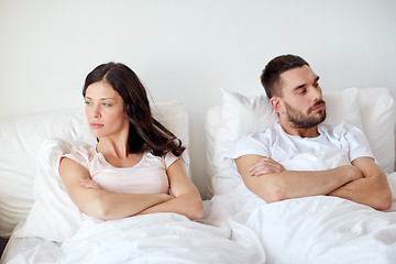 Image showing unhappy couple having conflict in bed at home