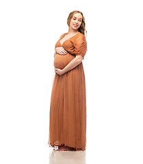 Image showing happy pregnant woman touching her big belly