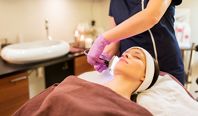 Image showing young woman having face microdermabrasion at spa