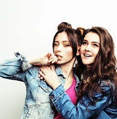 Image showing best friends teenage girls together having fun, posing emotional on white background, besties happy smiling, lifestyle people concept close up