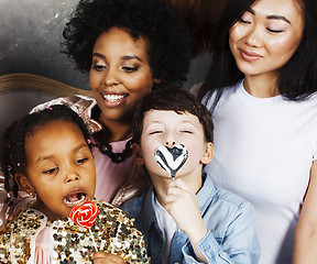 Image showing Lifestyle and people concept: young pretty diversity nations woman with different age children celebrating on birth day party together happy smiling, making selfie. African-american, asian and caucasi