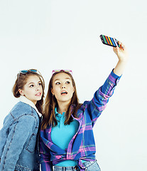 Image showing best friends teenage girls together having fun, posing emotional on white background, besties happy smiling, lifestyle people concept close up