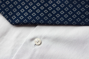 Image showing close up of shirt and blue patterned tie