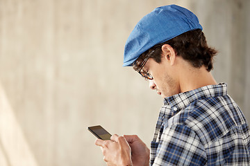 Image showing close up of man texting message on smartphone