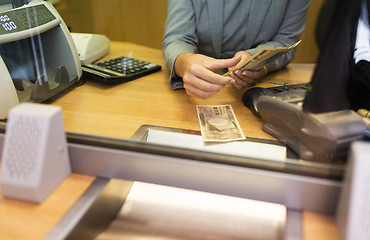 Image showing clerk counting cash money at bank office