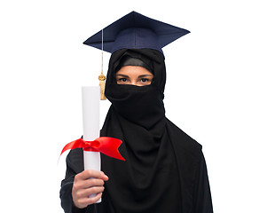 Image showing muslim woman in hijab and mortarboard with diploma