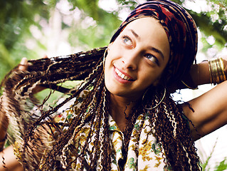 Image showing Young cute smiling real stylish dressed woman in green palm park smiling, resting, enjoing, lifestyle outside concept