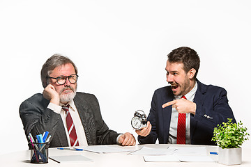 Image showing The two colleagues working together at office on white background.