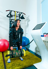 Image showing The female athlete doing they exercise in a ems fitness studio