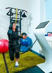 Image showing The female athlete doing they exercise in a ems fitness studio