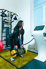 Image showing The female athlete doing they exercise in a ems fitness studio