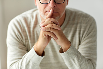 Image showing close up of senior man in glasses thinking