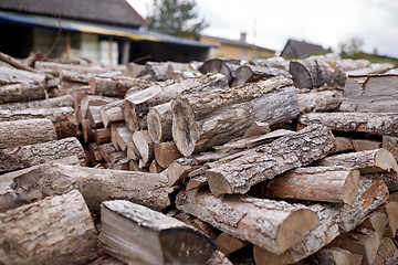 Image showing stack of firewood on farm at country