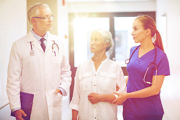 Image showing medics and senior patient woman at hospital