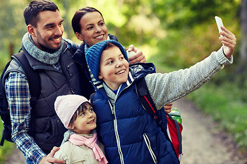 Image showing family taking selfie with smartphone in woods