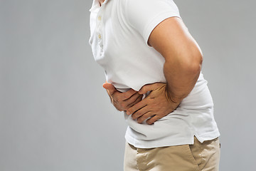 Image showing close up of man suffering from stomach ache