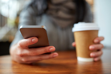 Image showing close up of woman with smartphone and coffee