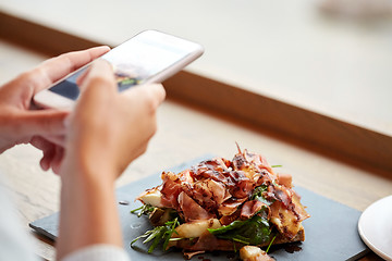 Image showing hands with smartphone photographing food