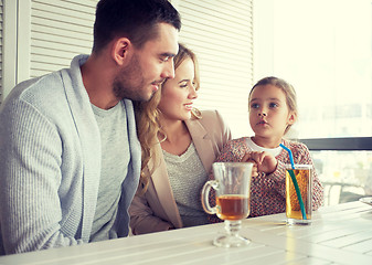 Image showing happy family having dinner at restaurant or cafe