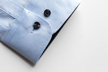 Image showing close up of blue shirt sleeve