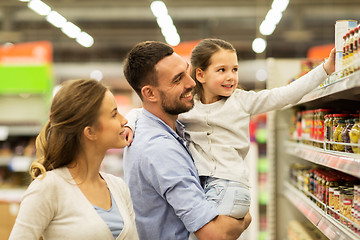 Image showing happy family buying food at grocery store