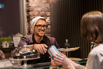 Image showing man or barman serving customer at vegan cafe