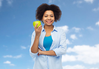 Image showing happy african american woman with green apple