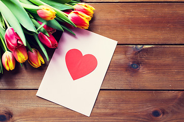 Image showing close up of flowers and greeting card with heart