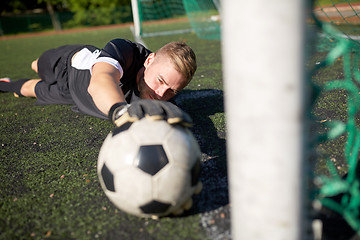 Image showing goalkeeper with ball at football goal on field