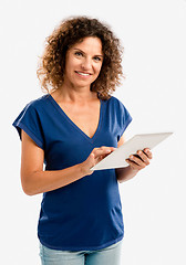 Image showing Happy woman working with a tablet