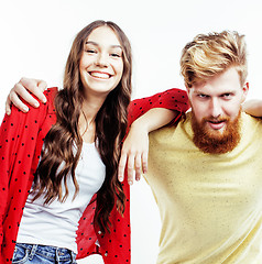 Image showing young pretty teenage couple, hipster guy with his girlfriend happy smiling and hugging isolated on white background, lifestyle people concept 