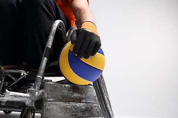 Image showing Handball in a wheelchair The man on the sports wheelchair with the ball 