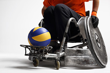 Image showing Handball in a wheelchair The man on the sports wheelchair with the ball 