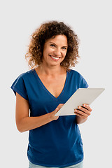 Image showing Happy woman working with a tablet