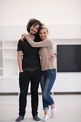 Image showing couple hugging in their new home