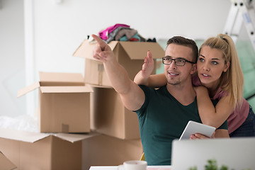 Image showing Young couple moving in a new home