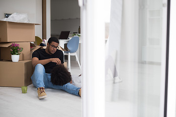 Image showing African American couple relaxing in new house