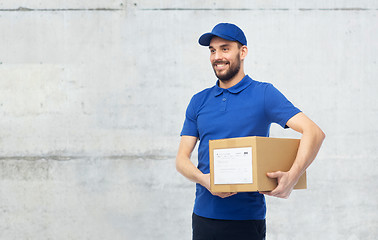 Image showing happy delivery man with parcel box